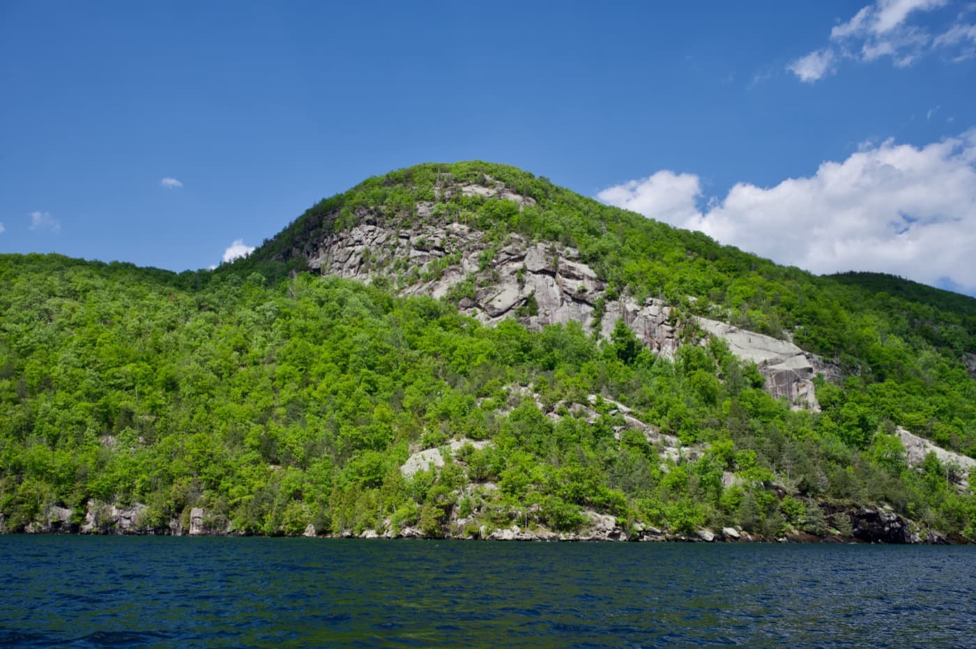 Anthony's Nose, a forested cliff rising roughly 900 feet