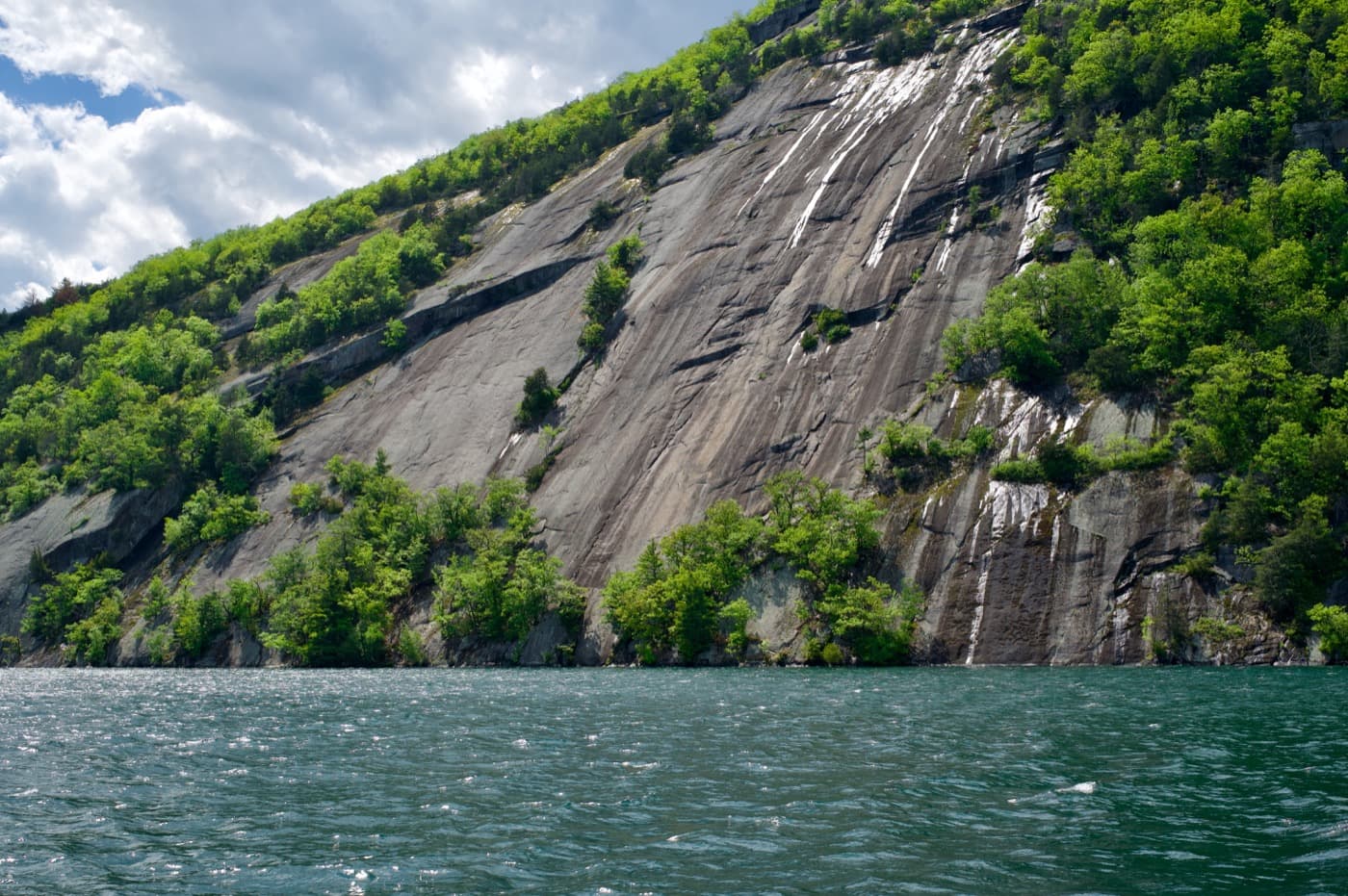 Rogers Slide, a massive 700-foot granite rock face rising straight out of Lake George — reachable only by boat